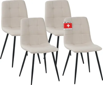 Four beige dining chairs with black legs are arranged in a studio setting against a white background.