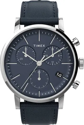 A close-up studio shot of a Timex chronograph watch with a blue dial and a dark blue leather strap.