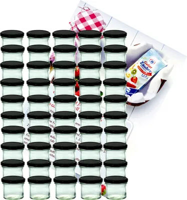 A large group of small glass jars with black lids, arranged in rows, with a packet of jelly powder and a checkered cloth in the background.