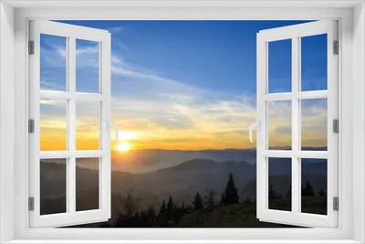 Produktbild von Wallario selbstklebendes Poster mit Fenster-Illusion - Sonnenaufgang über dem Schwarzwald, Größe: 61 x 91,50 cm