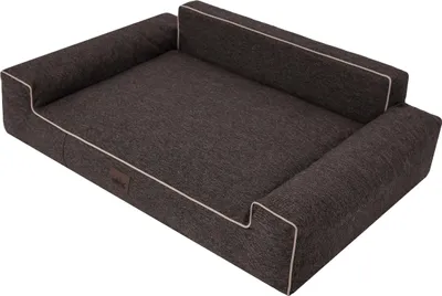 A dark gray dog bed with white trim is shown against a white background.