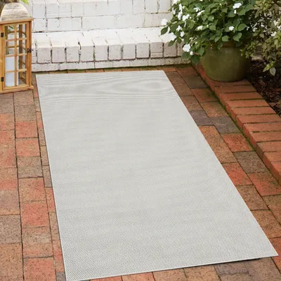 Zdjęcie produktu dla Dywan wewnętrzny i zewnętrzny o jasnym płaskim splocie w kolorze kremowym Rozmiar - 80 x 150 cm