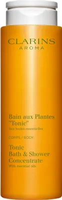 A close-up shot of a Clarins bath and shower concentrate bottle.