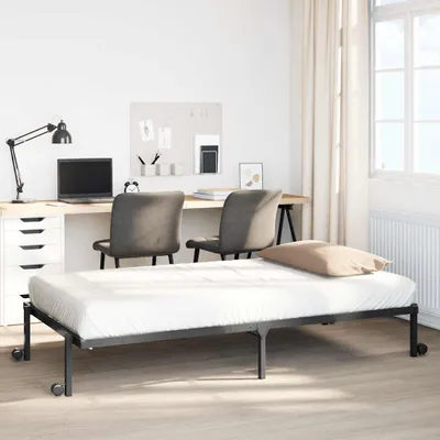 A bedroom or study setup with a bed, desk, and chairs.