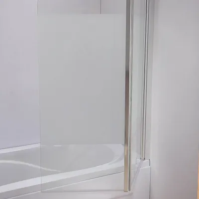 A close-up view of a shower screen attached to a bathtub.