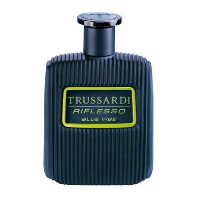 A studio shot of a blue perfume bottle with a yellow label.