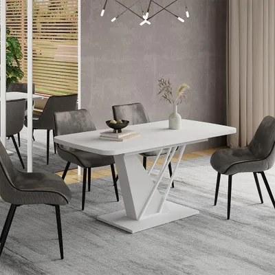 A dining room scene with a white table and chairs.