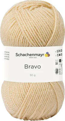A ball of beige yarn with a label.