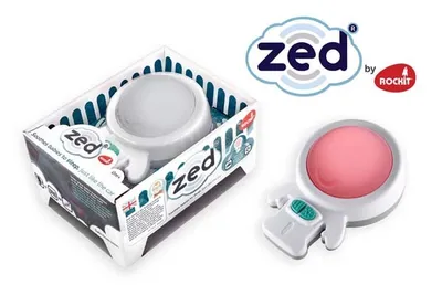 A product box with a baby sleep aid inside, and the product itself displayed separately.