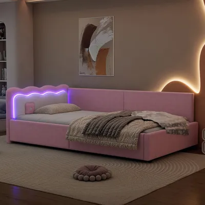 A pink upholstered daybed with LED lighting in a bedroom setting.