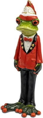 A ceramic figurine of a frog dressed in a red tuxedo and a carnival hat.