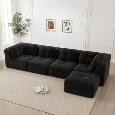 Immagine prodotto di Divano modulare a quattro posti, colore nero. Divano imbottito senza struttura, realizzato con schiuma 32D, dimensioni 386x177x69 cm. Seduta profonda. Non richiede montaggio
