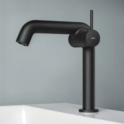 A black faucet is shown on a white surface against a gray background.