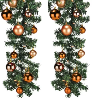 Two identical garlands of artificial Christmas tree branches decorated with orange and bronze baubles against a white background.