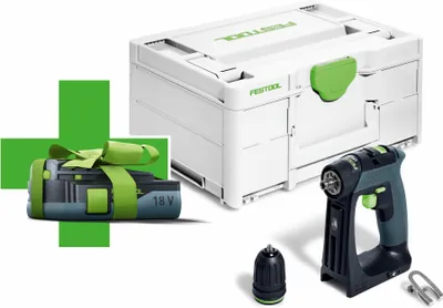A Festool cordless drill, battery, and storage case are displayed with a green cross overlay and a ribbon-tied battery.