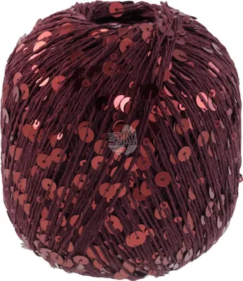 A ball of burgundy yarn with red sequins.
