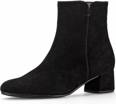 A black suede ankle boot with a block heel is shown against a white background.