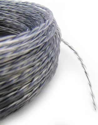 A close-up, coiled spool of twisted gray and white string or cable against a white background.