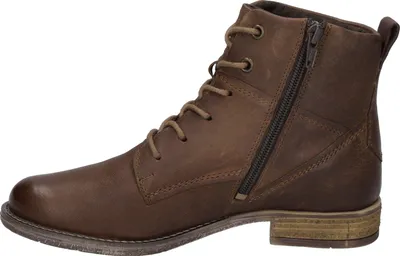 A side view of a brown leather boot.