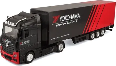 A toy model truck with a trailer, branded with Yokohama Motorsports.