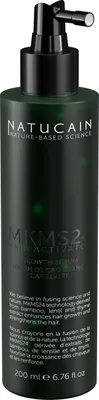 A dark green bottle of Natucain Hair Growth Serum with a black pump dispenser.