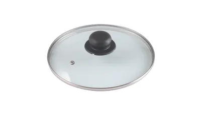 A close-up shot of a glass pot lid with a black knob and a silver rim.