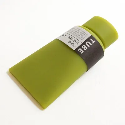 Produktbild von Türstopper für Farbtuben – Grün