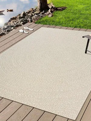 Imagen del producto de Unyqoos® Alfombra Kansas: Alfombra robusta para interiores y exteriores, con aspecto de yute natural y un diseño de círculos en color crema, resistente a la intemperie y a los rayos UV, de 80 x 150 cm