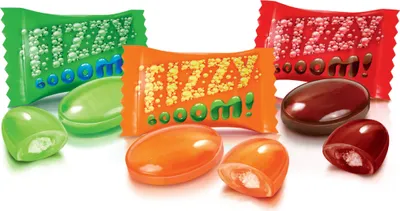 A studio shot of assorted candies and their wrappers.