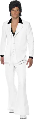 A man wearing a white disco costume with a black collar and a black wig.