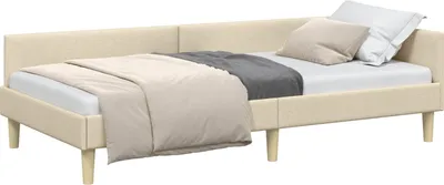 A corner bed frame with bedding and pillows.