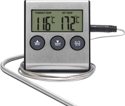 A digital meat thermometer with a stainless steel probe rests on a white background.