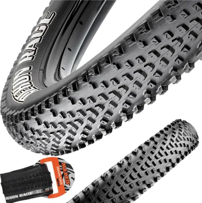 A close-up view of a bicycle tire with a detailed tread pattern.