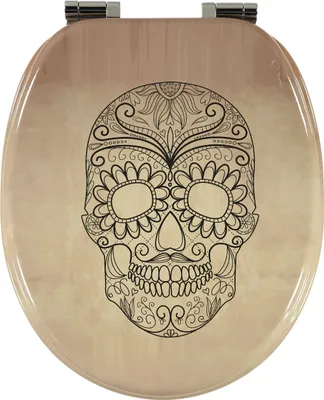 A toilet seat with a decorative skull design.