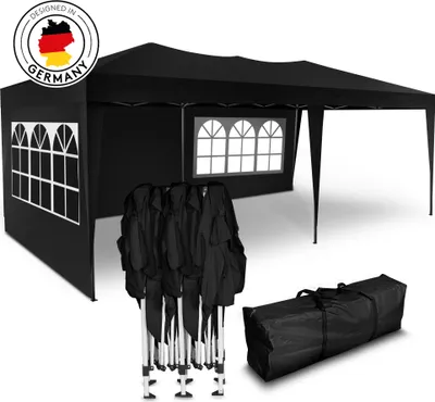 A black pop-up tent with windows and folded tent poles and a carrying bag.