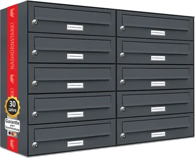 A wall of dark gray mailboxes with a red stripe on the left side containing text and logos, and a yellow circular badge with text.