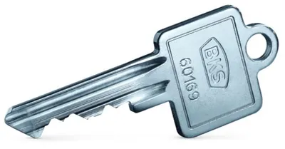 A close-up studio shot of a silver key against a white background.