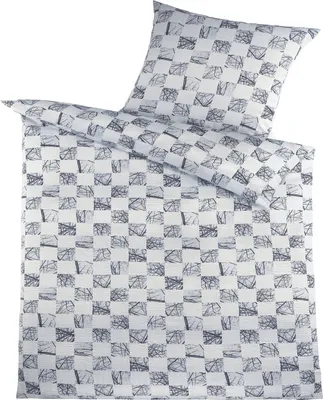 A duvet cover and pillowcase set with a checkered pattern of abstract shapes.