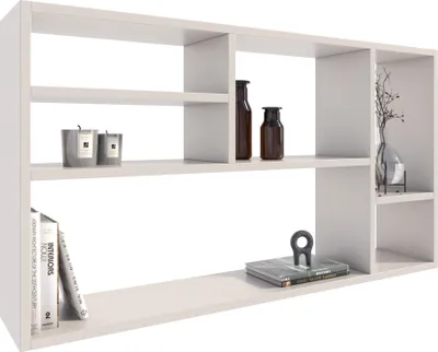 A white wall shelf with various decorative items.