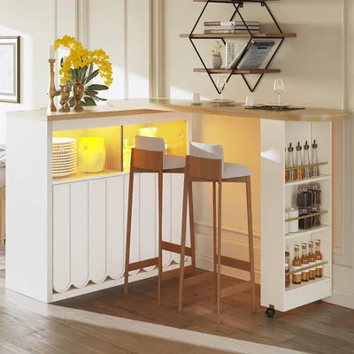 A modern bar table with integrated lighting and storage, set in a dining or living area.