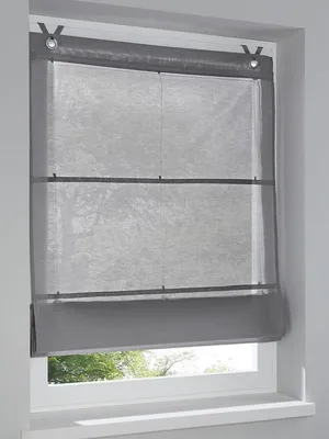 A gray Roman blind is installed on a window.