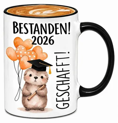 Zdjęcie produktu dla Filiżanka "Bestanden! 2026" z motywem leniwca, ceramika, 325 ml, biało-czarna