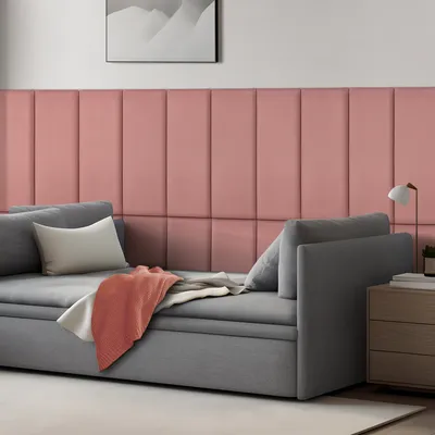 A modern living room scene featuring a sofa with decorative wall panels behind it.