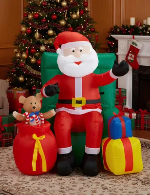 Produktbild von Aufblasbarer Weihnachtsmann sitzend mit Geschenken 122 cm -
