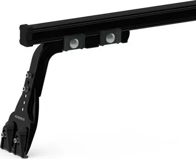 A black car roof rack foot is shown against a white background.