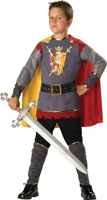 A young boy dressed as a knight, holding a toy sword.
