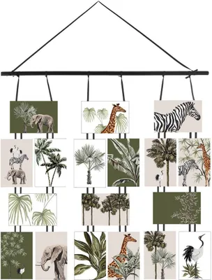 A collage of various safari-themed prints, including elephants, giraffes, zebras, and tropical foliage, arranged in a hanging display.