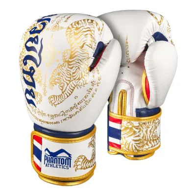 A pair of white and gold Muay Thai boxing gloves with intricate designs.