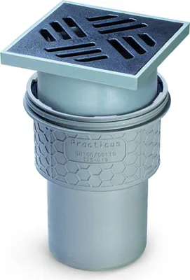 A floor drain with a grate on top, shown against a white background.