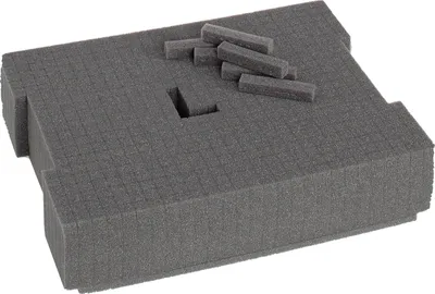 A gray foam insert with pre-cut squares, designed to fit inside a L-BOXX.